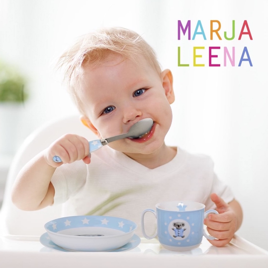 Toddler using the Marja Leena and Gibson Gifts Koala tableware range